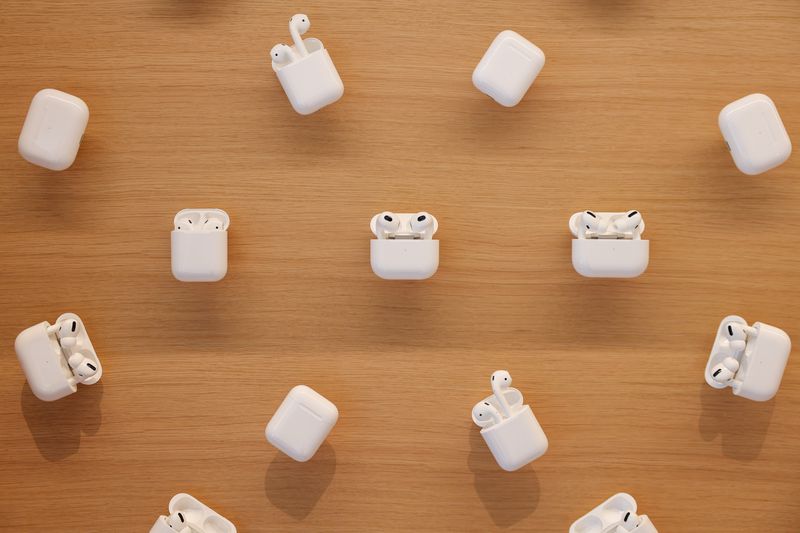 Several sets of AirPods are on display in an Apple Store.