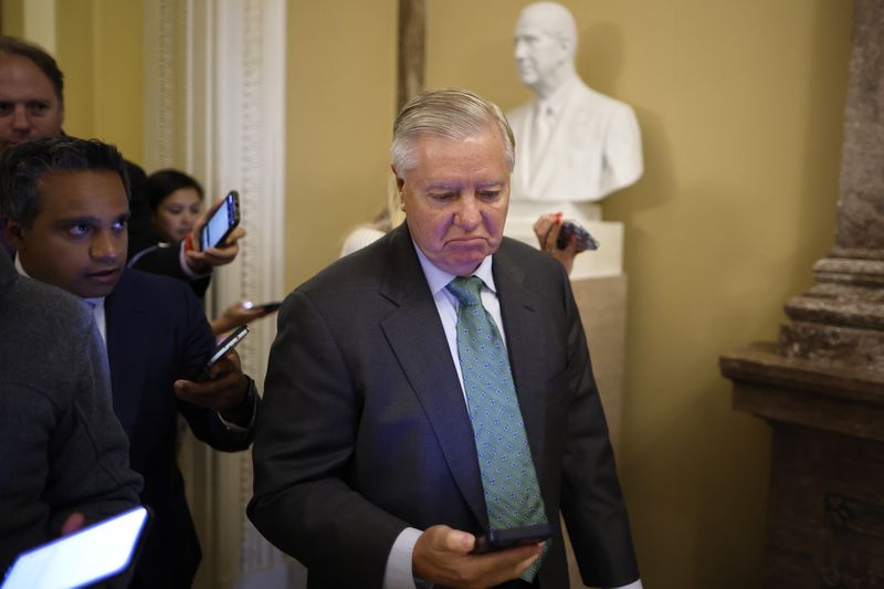 Sen. Lindsey Graham glaring at his phone.